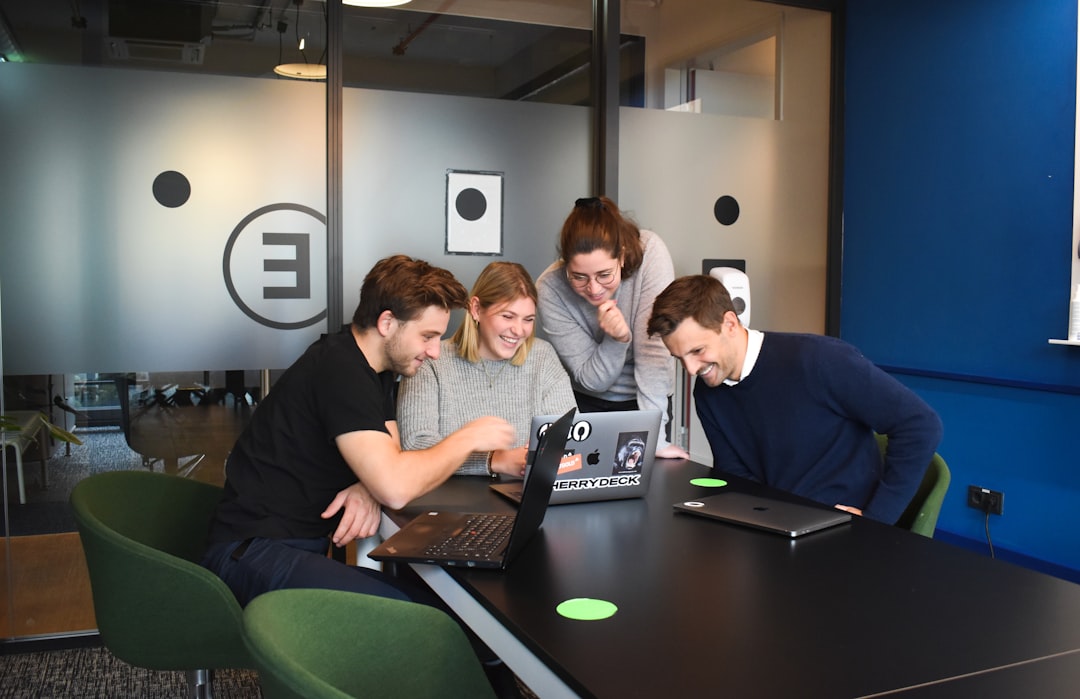 about-us people-sitting-on-chair-in-front-of-laptop-computers-rmilc1piwm0